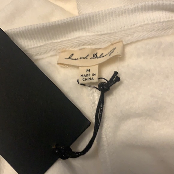 Long sleeve white shirt that says peace of mind - Picture 3 of 3